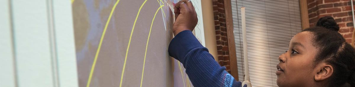 Education Student using a SMART Board