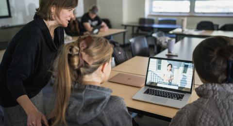 Clinical Professor Melinda Morrill teaching a counseling class using AI computer modules