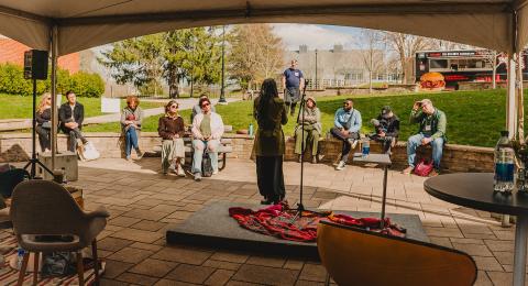 Women performing poetry outside