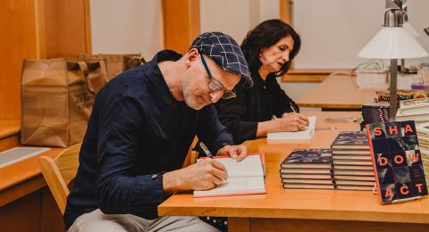 Book signing taking place at the poetry festival