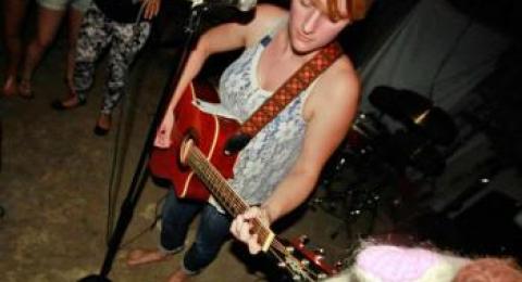 Hannah Peckham playing guitar