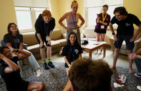 FLI campers playing a card game