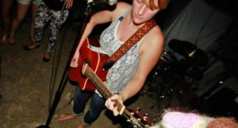 Hannah Peckham playing guitar