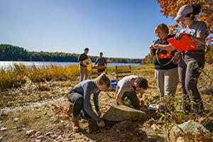 faculty and students digging at Great Bay