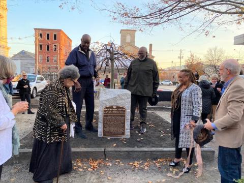 BIPOC MONUMENTALITY IN NEW HAMPSHIRE” LEAD TEAM MEMBER JERRIANNE BOGGIS, EXECUTIVE DIRECTOR OF THE BLACK HERITAGE TRAIL OF NEW HAMPSHIRE (MIDDLE RIGHT), AT THE UNVEILING OF THE POMP AND CANDACE SPRING MARKER IN PORTSMOUTH IN NOVEMBER 2021