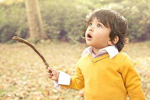 boy looking skyward in wonder