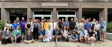 2023 cohort of educators and UNH staff and partners for NEH Landmarks institute pose for group photo in front of McConnell Hall