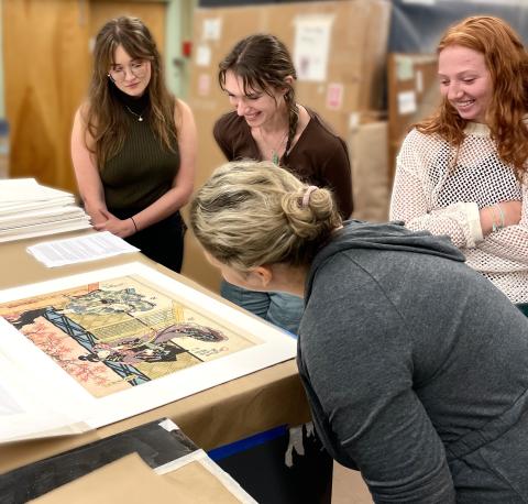 Students viewing a Japanese print