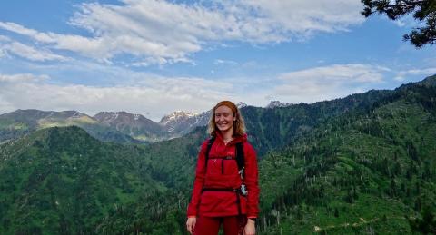 photo of student hiking in mountains